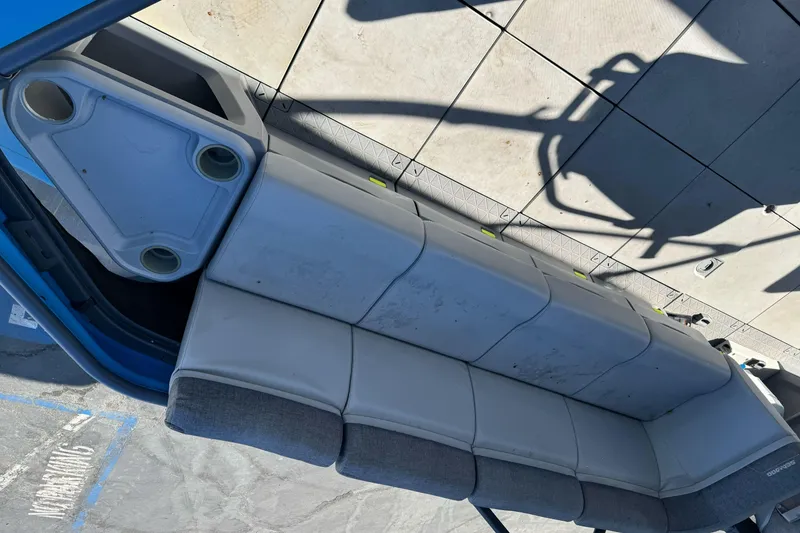 Slide: The Image of 2023 Sea-Doo Switch Cruise 21 boat seating with integrated cup holders. - 12