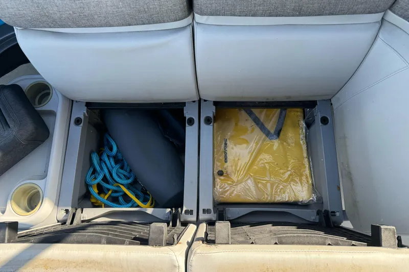 Slide: The Image of 2023 Sea-Doo Switch Cruise 21 storage compartments with ropes and life jacket. - 25