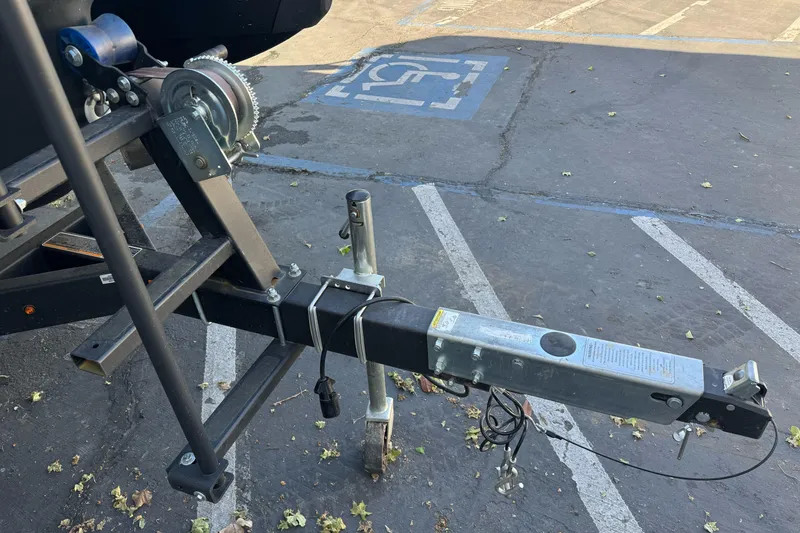 Slide: The Image of Trailer hitch and winch for 2023 Sea-Doo Switch Cruise 21 in parking lot. - 8