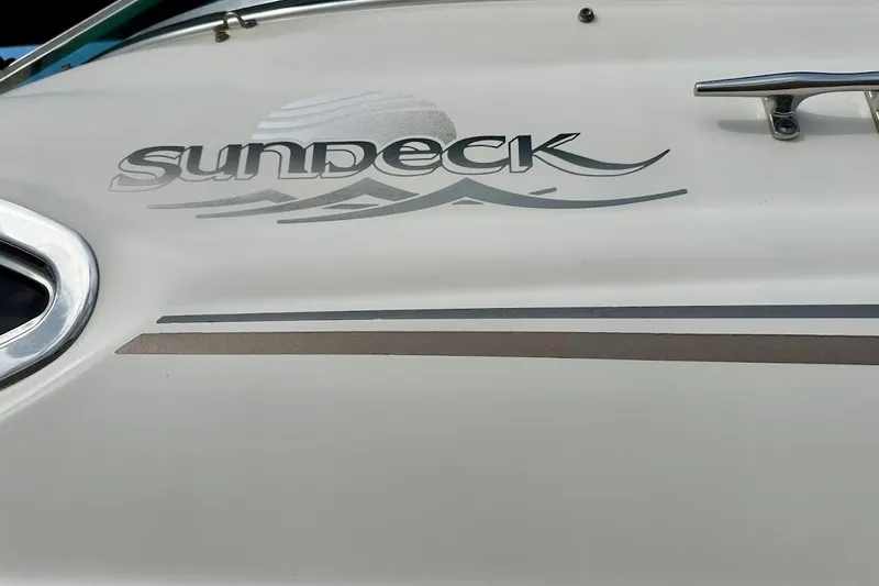 Slide: The Image of Close-up of 2004 Sea Ray 270 Sundeck boat logo and design details. - 7
