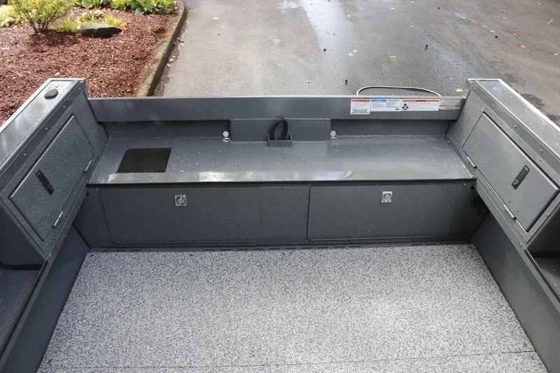 Slide: The Image of Interior view of 2026 Alumaweld Free Drifter 18 boat, showcasing storage compartments. - 14