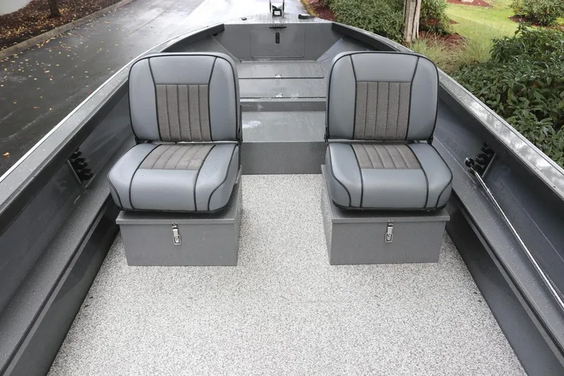 Slide: The Image of 2026 Alumaweld Free Drifter 18 boat interior with two gray cushioned seats. - 2