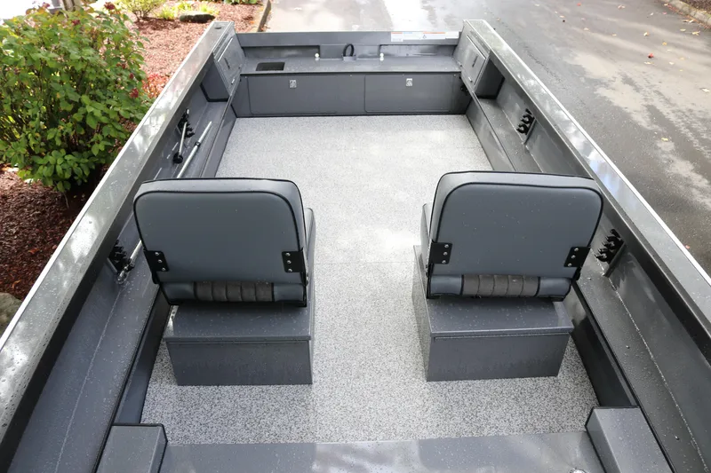 Slide: The Image of 2026 Alumaweld Free Drifter 18 boat interior with two gray seats and spacious deck. - 3