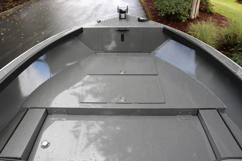Slide: The Image of 2026 Alumaweld Free Drifter 18 boat deck, featuring sleek gray design and storage compartments. - 4