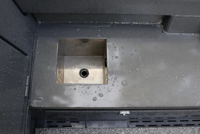 Slide: The Image of Stainless steel sink on 2026 Alumaweld Free Drifter 18 boat, with water droplets. - 9
