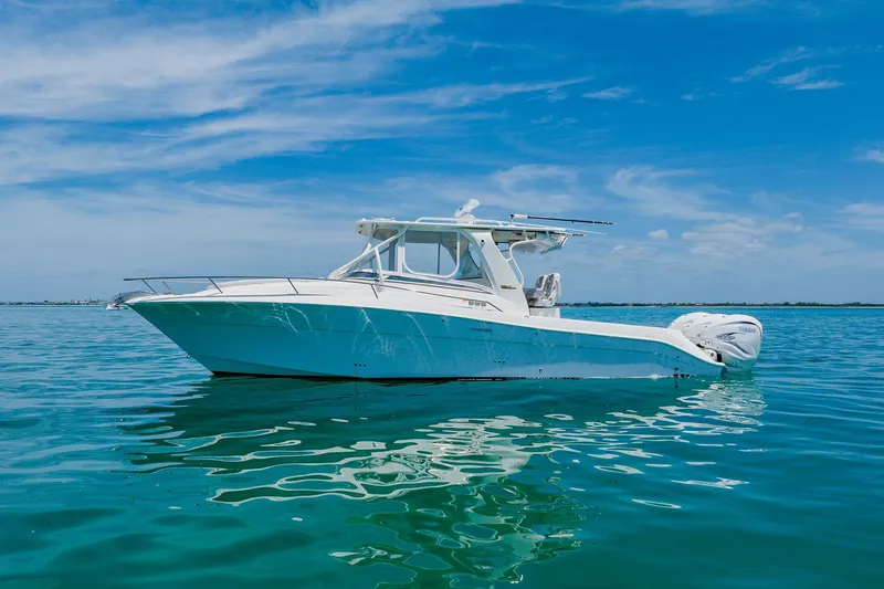 The Image of 2008 Hydra-Sports Vector 3500 VX boat on calm blue water under clear sky. - 1