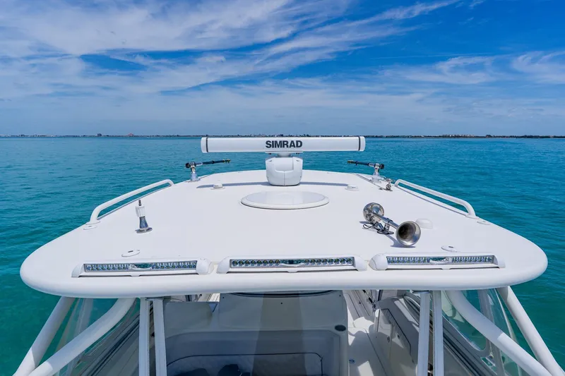 Slide: The Image of 2008 Hydra-Sports Vector 3500 VX boat on clear blue water under a sunny sky. - 14