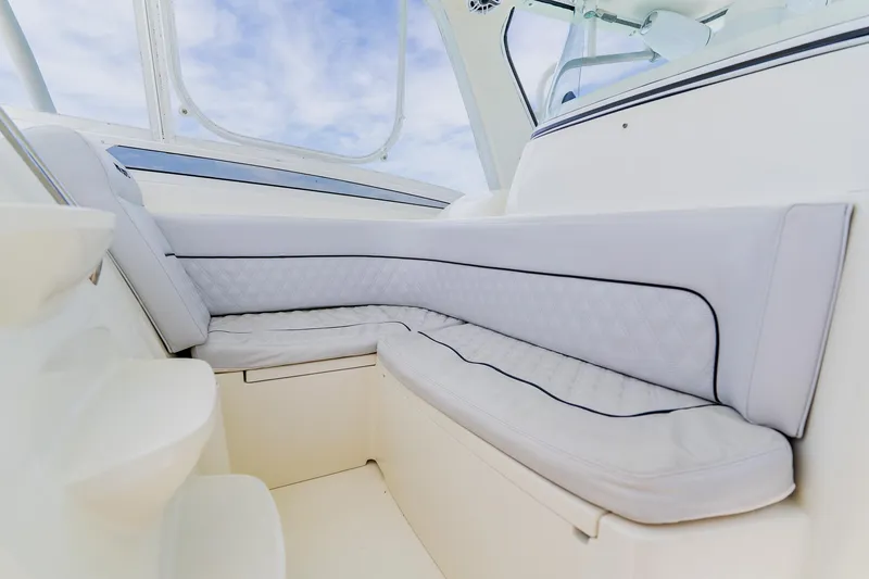 Slide: The Image of 2008 Hydra-Sports Vector 3500 VX interior seating with white cushioned upholstery. - 16