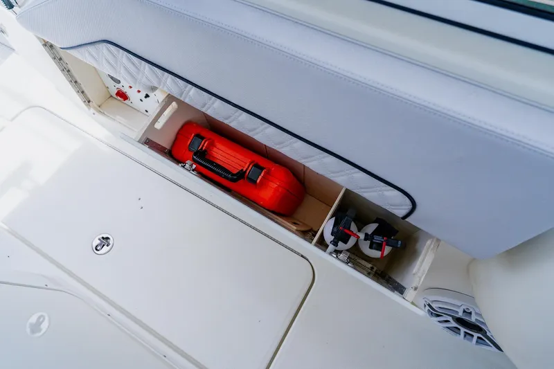 Slide: The Image of Storage compartment on a 2008 Hydra-Sports Vector 3500 VX boat with safety equipment. - 20