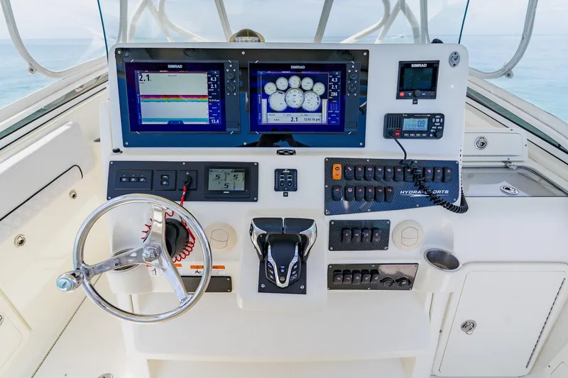 Slide: The Image of 2008 Hydra-Sports Vector 3500 VX boat dashboard with navigation and control systems. - 26