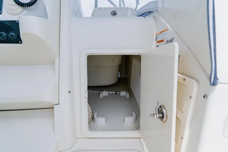 Slide: The Image of 2008 Hydra-Sports Vector 3500 VX boat storage compartment with open door. - 28