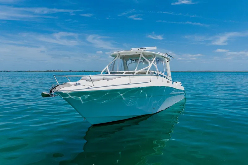 Slide: The Image of 2008 Hydra-Sports Vector 3500 VX boat on calm blue water under clear sky. - 3