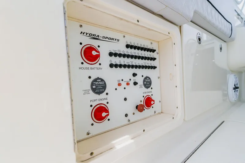 Slide: The Image of Control panel of a 2008 Hydra-Sports Vector 3500 VX boat, featuring battery switches. - 30