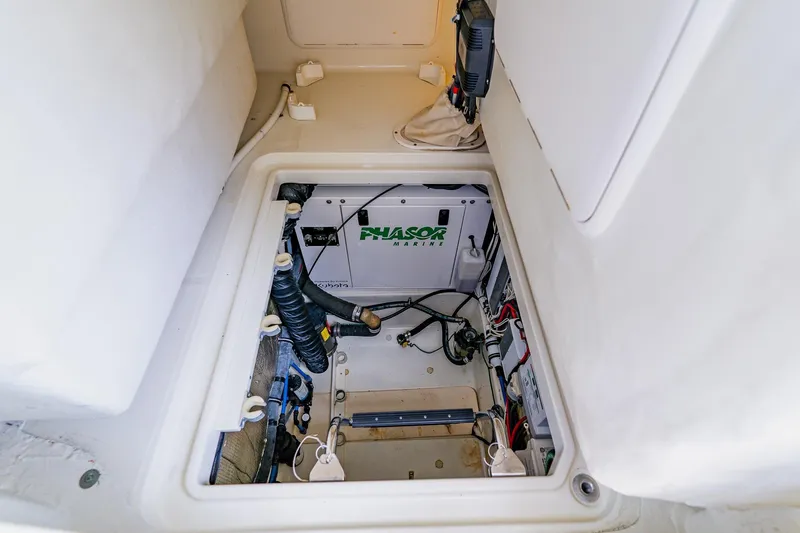 Slide: The Image of Engine compartment of 2008 Hydra-Sports Vector 3500 VX boat, featuring Phasor Marine generator. - 31
