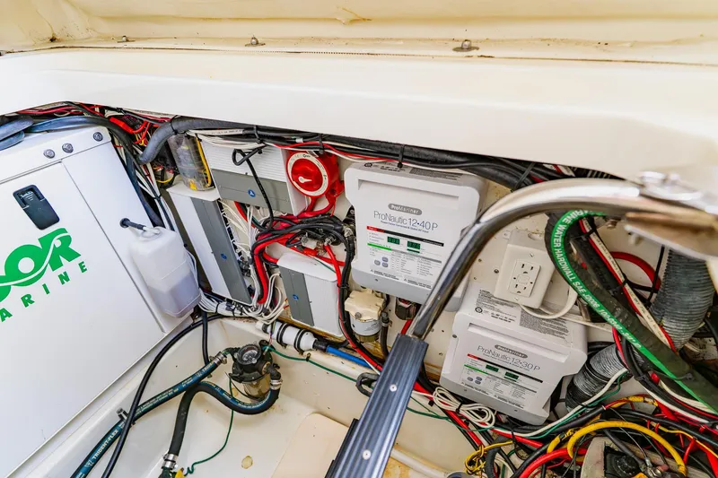 Slide: The Image of 2008 Hydra-Sports Vector 3500 VX engine compartment with wiring and ProNautic chargers. - 33