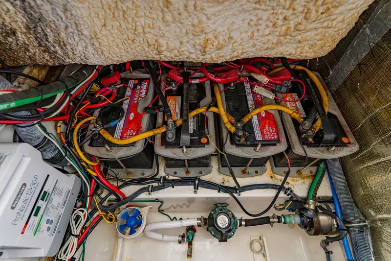 Slide: The Image of 2008 Hydra-Sports Vector 3500 VX boat battery compartment with wiring and connections. - 34