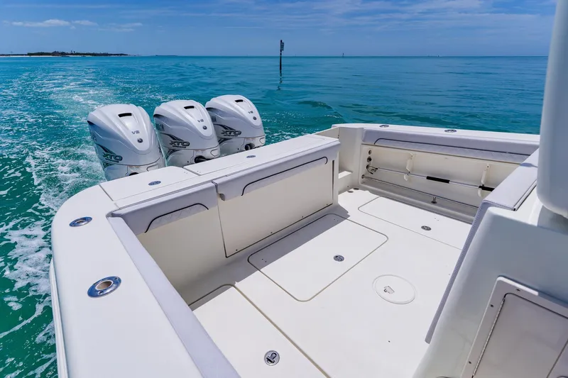 Slide: The Image of 2008 Hydra-Sports Vector 3500 VX boat with triple outboard engines on open sea. - 40