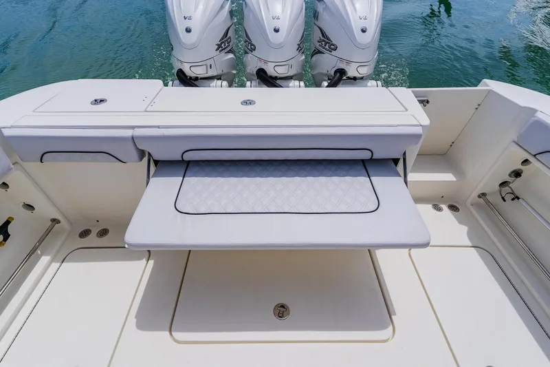 Slide: The Image of 2008 Hydra-Sports Vector 3500 VX boat deck with seating and triple outboard engines. - 43