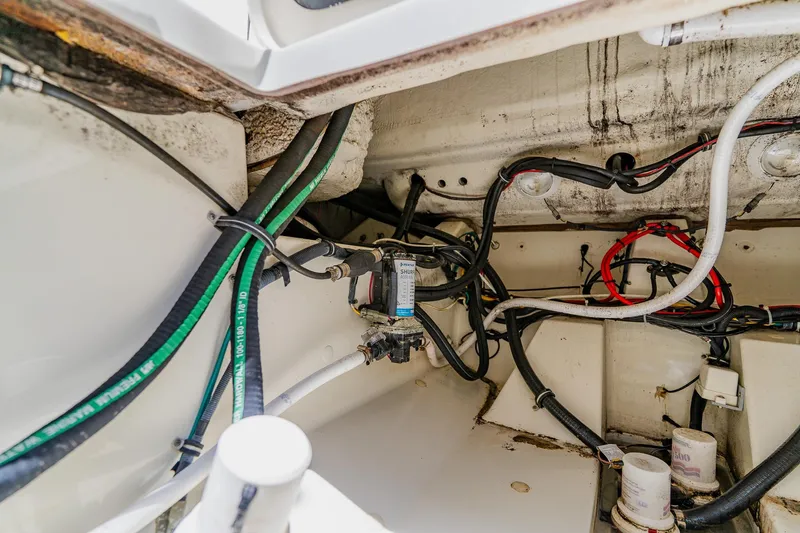 Slide: The Image of 2008 Hydra-Sports Vector 3500 VX engine compartment with wiring and hoses. - 47