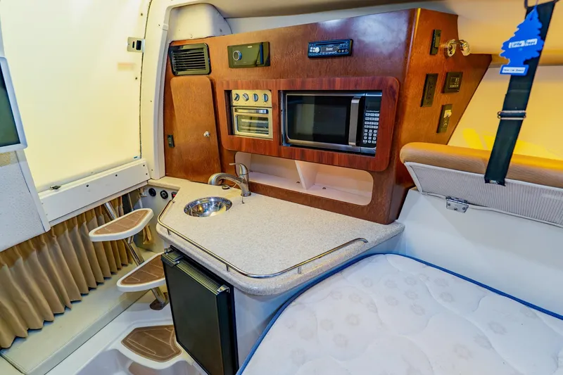 Slide: The Image of 2008 Hydra-Sports Vector 3500 VX cabin interior with kitchenette and sleeping area. - 51