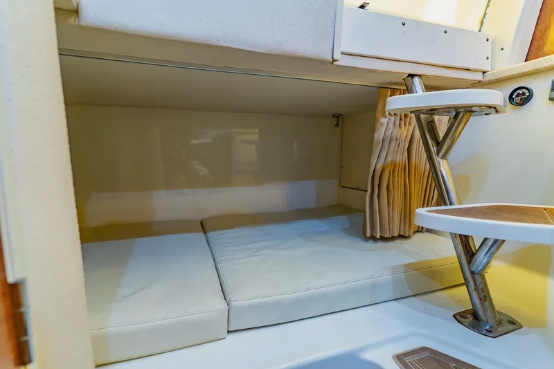 Slide: The Image of 2008 Hydra-Sports Vector 3500 VX cabin interior with cushioned seating and compact table. - 54