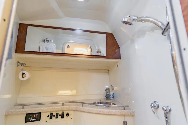 Slide: The Image of 2008 Hydra-Sports Vector 3500 VX boat bathroom with sink, mirror, and showerhead. - 56