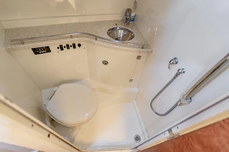 Slide: The Image of 2008 Hydra-Sports Vector 3500 VX boat bathroom with toilet, sink, and shower fixtures. - 57