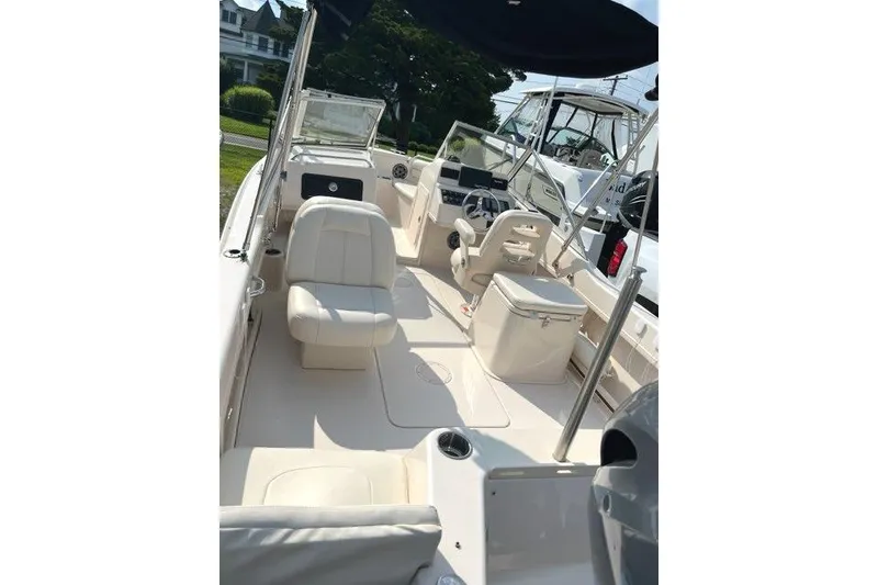 Slide: The Image of 2020 Grady-White Freedom 192 boat interior with seating and steering console. - 3