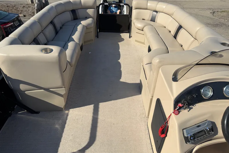 Slide: The Image of 2012 Bentley Pontoons 240 CRUISE interior with beige seating and control panel. - 11