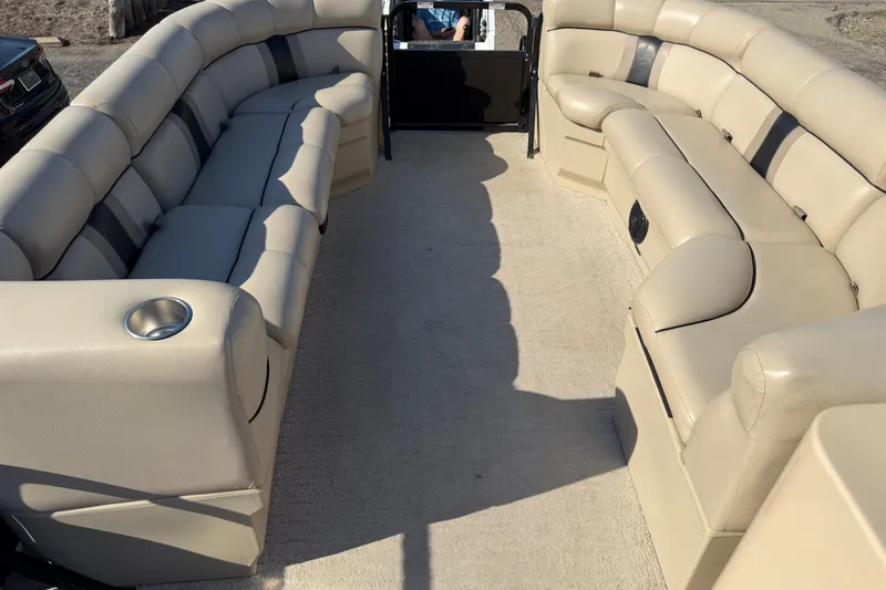 Slide: The Image of 2012 Bentley Pontoons 240 CRUISE interior with beige seating and cup holders. - 12