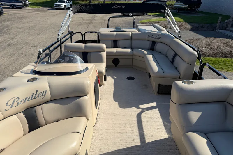Slide: The Image of 2012 Bentley Pontoons 240 CRUISE with beige seating and spacious deck layout. - 2