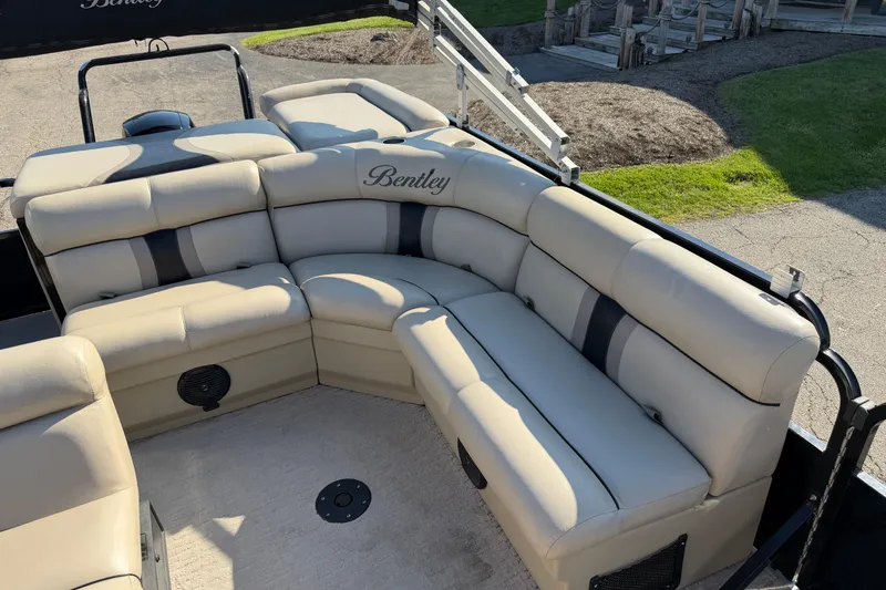 Slide: The Image of 2012 Bentley Pontoons 240 CRUISE with beige seating and black accents, outdoor setting. - 8