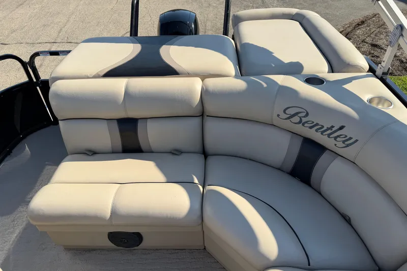 Slide: The Image of Luxurious seating on a 2012 Bentley Pontoons 240 CRUISE boat, featuring elegant beige upholstery. - 9