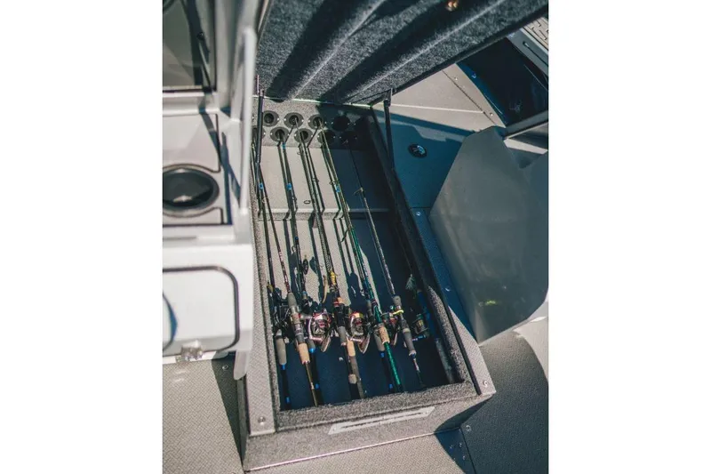 Slide: The Image of Fishing rods stored in a compartment of a 2026 KingFisher 2125 Arrow Sport boat. - 5