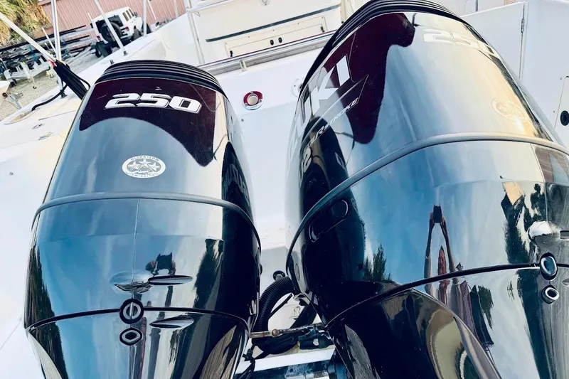 Slide: The Image of Twin Suzuki 250 outboard engines on a 2002 Boston Whaler 290 Outrage boat. - 17