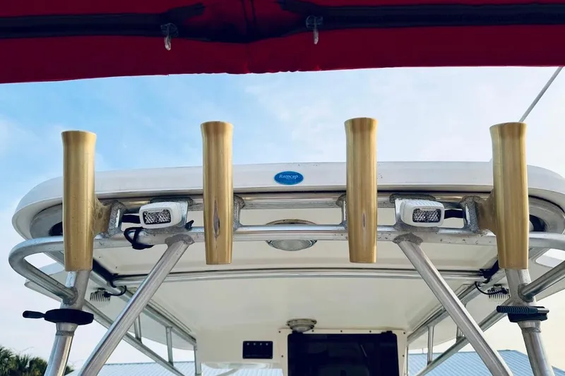 Slide: The Image of Boston Whaler 290 Outrage 2002 boat with rod holders and canopy. - 33