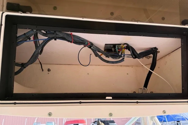 Slide: The Image of Electrical wiring inside a 2002 Boston Whaler 290 Outrage boat compartment. - 49
