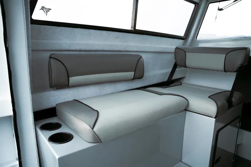 Slide: The Image of Interior seating of 2026 KingFisher 23 XAC boat, featuring modern design and cup holders. - 6