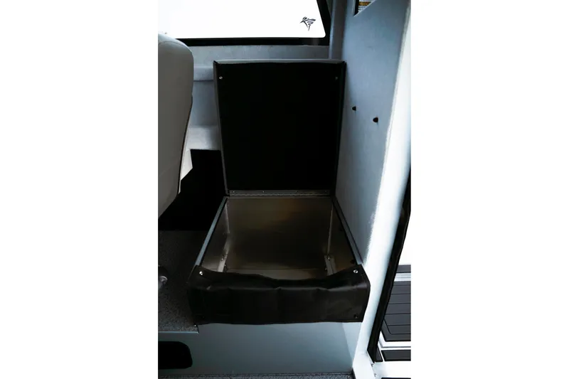 Slide: The Image of Open storage compartment in 2026 KingFisher 23 XAC boat interior. - 8