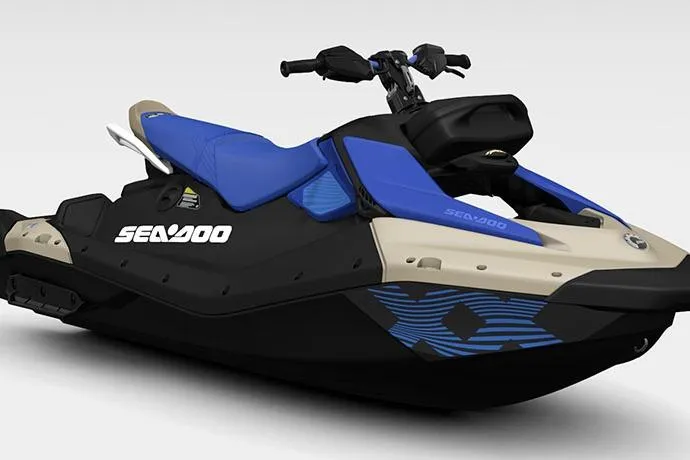 Slide: The Image of 2025 Sea-Doo Spark Trixx for 3, blue and black design, side view. - 6