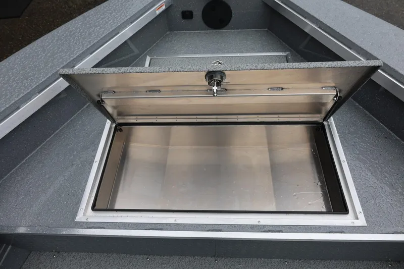 Slide: The Image of Open storage compartment on 2026 Thunder Jet 229 Rush OT boat. - 11