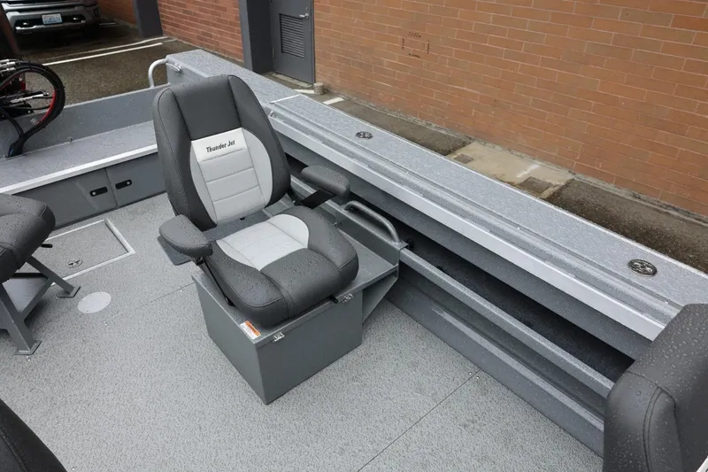 Slide: The Image of Captain's chair in 2026 Thunder Jet 229 Rush OT boat interior. - 14