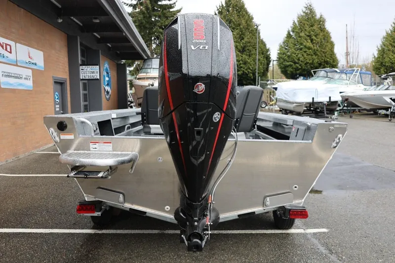 Slide: The Image of 2026 Thunder Jet 229 Rush OT boat with powerful V8 engine, parked outdoors. - 4