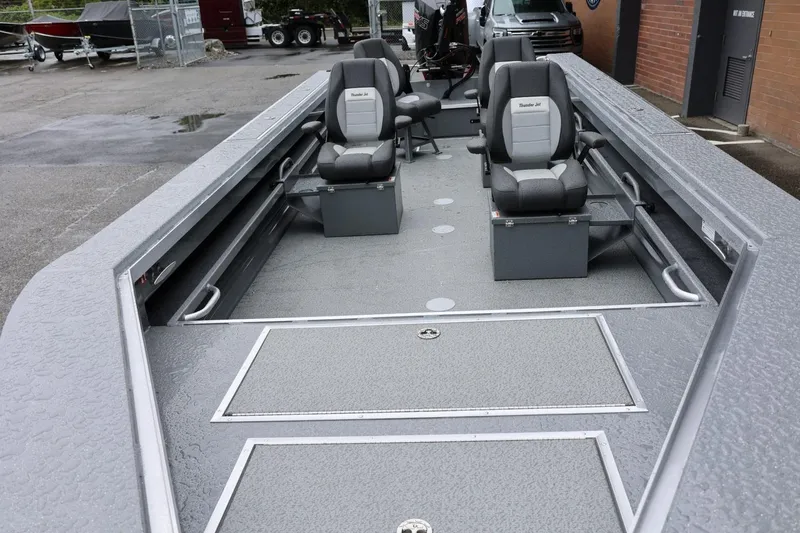 Slide: The Image of 2026 Thunder Jet 229 Rush OT boat interior with seating and storage compartments. - 8