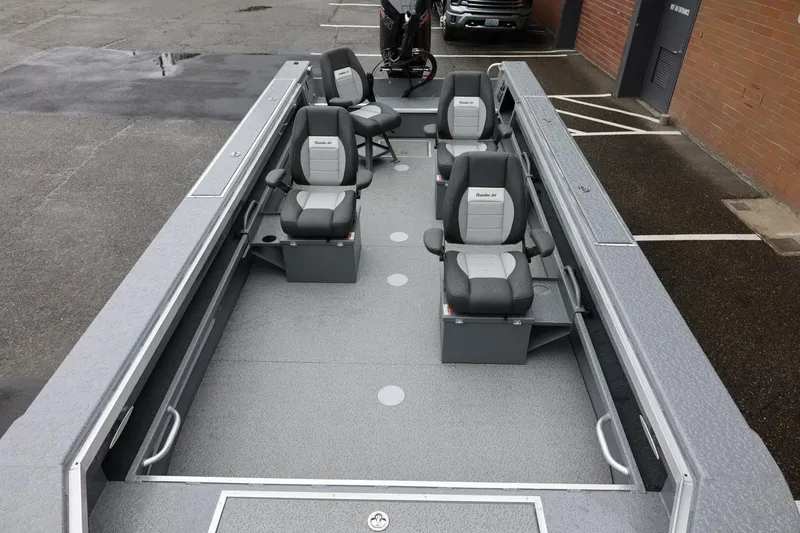 Slide: The Image of 2026 Thunder Jet 229 Rush OT boat interior with multiple seats and spacious layout. - 9