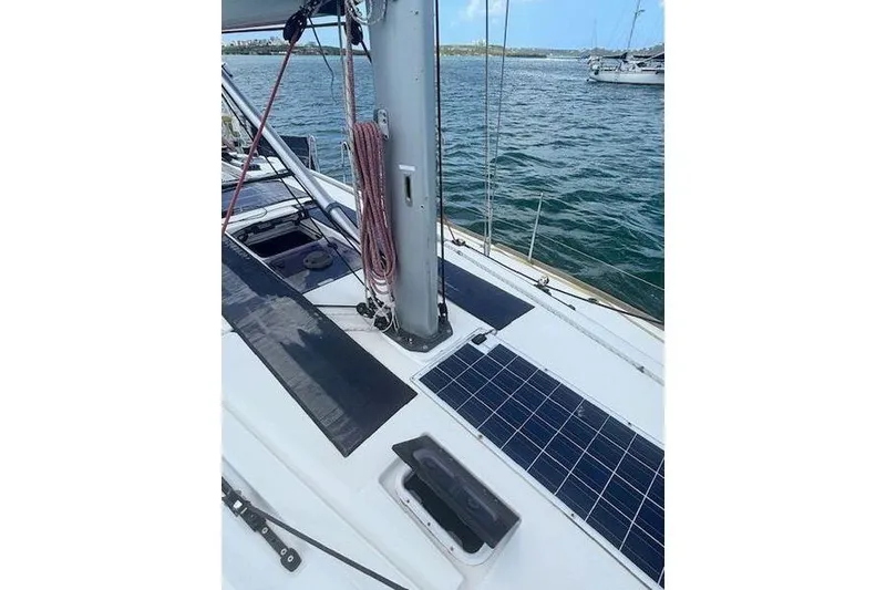 Slide: The Image of 2018 Jeanneau Sun Odyssey 419 sailboat deck with solar panels and rigging. - 23