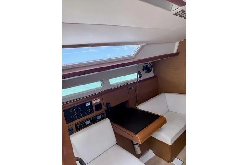 Slide: The Image of Interior of 2018 Jeanneau Sun Odyssey 419 sailboat with seating and navigation equipment. - 9
