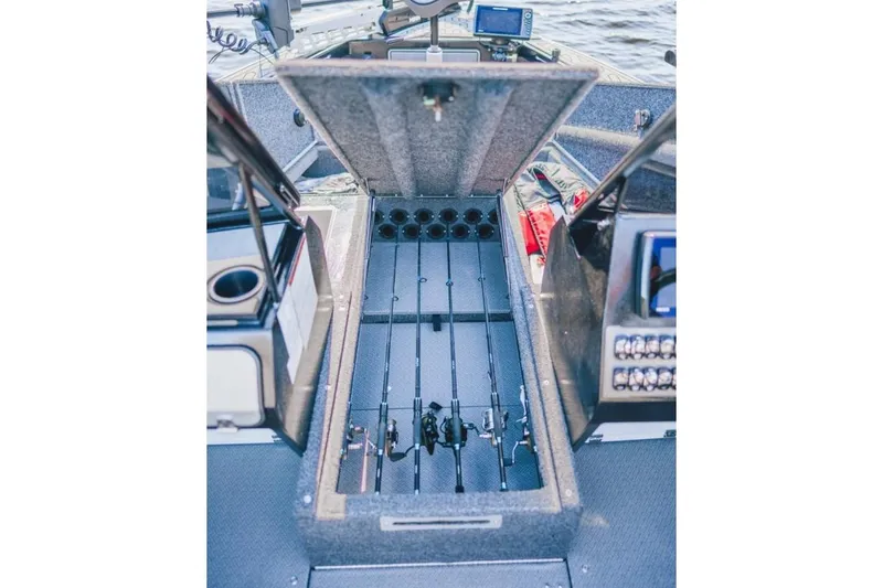 Slide: The Image of Interior of 2026 KingFisher 1925 Arrow Sport boat with open storage compartment. - 10