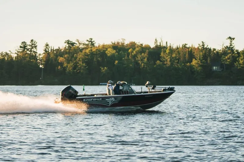 Slide: The Image of KingFisher 1925 Arrow Sport boat cruising on a scenic lake, 2026 model. - 12