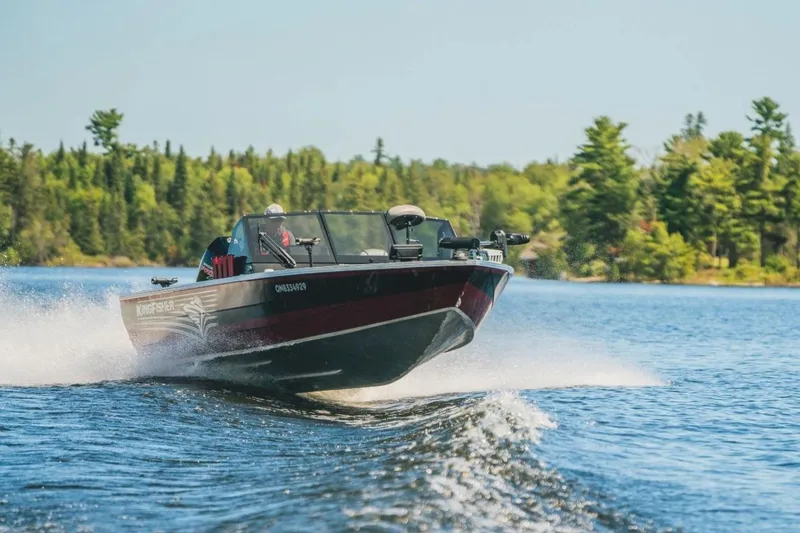 Slide: The Image of KingFisher 1925 Arrow Sport boat cruising on a scenic lake, 2026 model. - 3